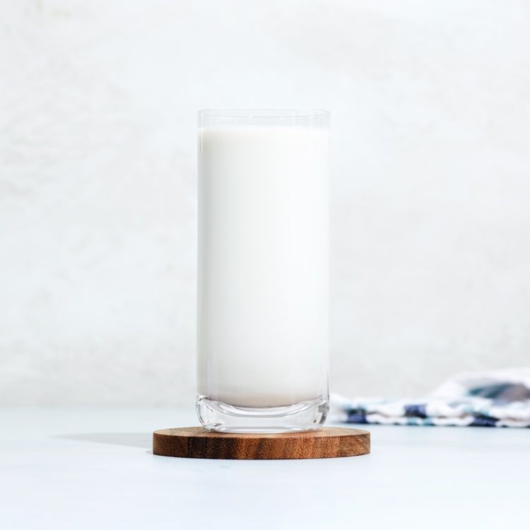 a glass of plant based milk
