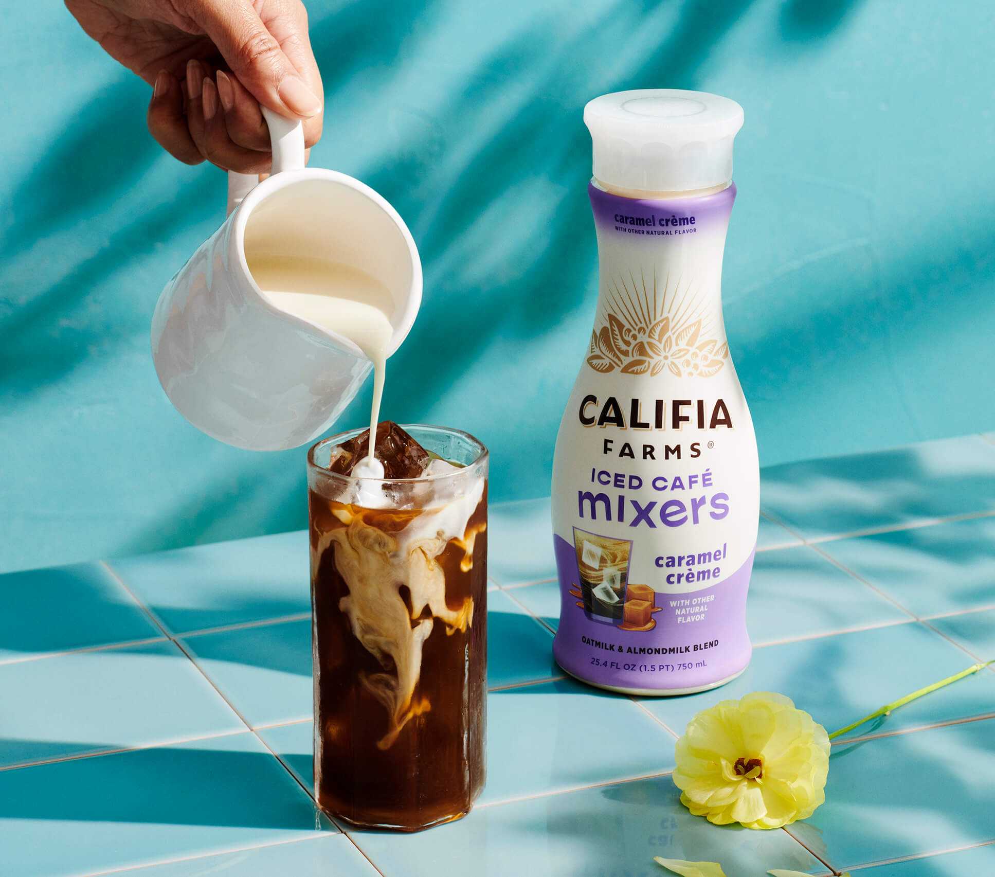 a close-up of Califia Mixer being poured into a glass of ice coffee